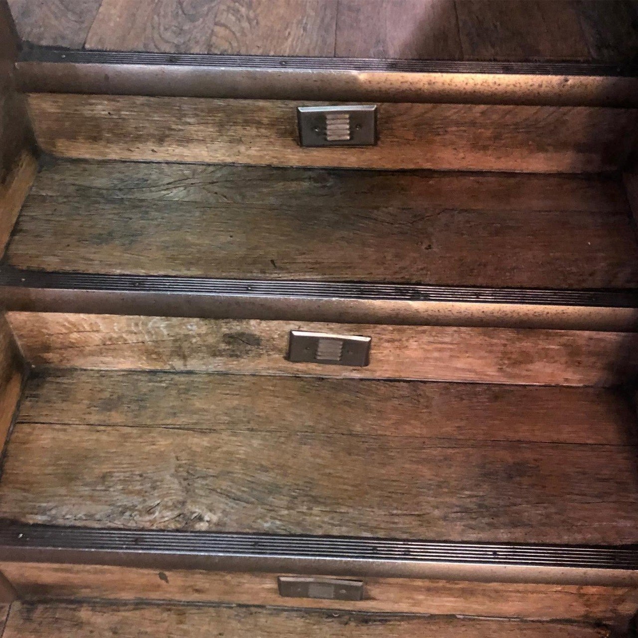 Commercial stairwell, stripped and refinished., before
